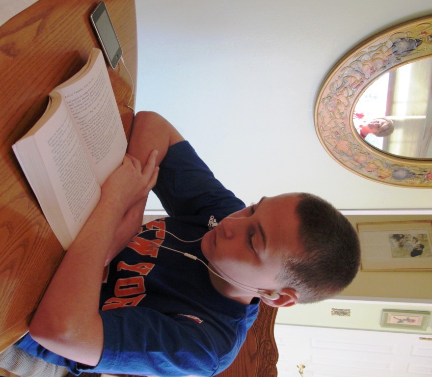 Daniel, dyslexic middle schooler reading Learning Ally audiobook with his iPod touch