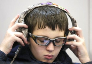 Student at Arcola Elementary listens to audiobooks.